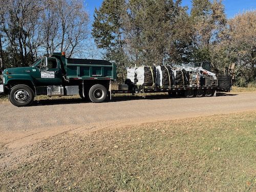 Truck hauling a large load of firewood
